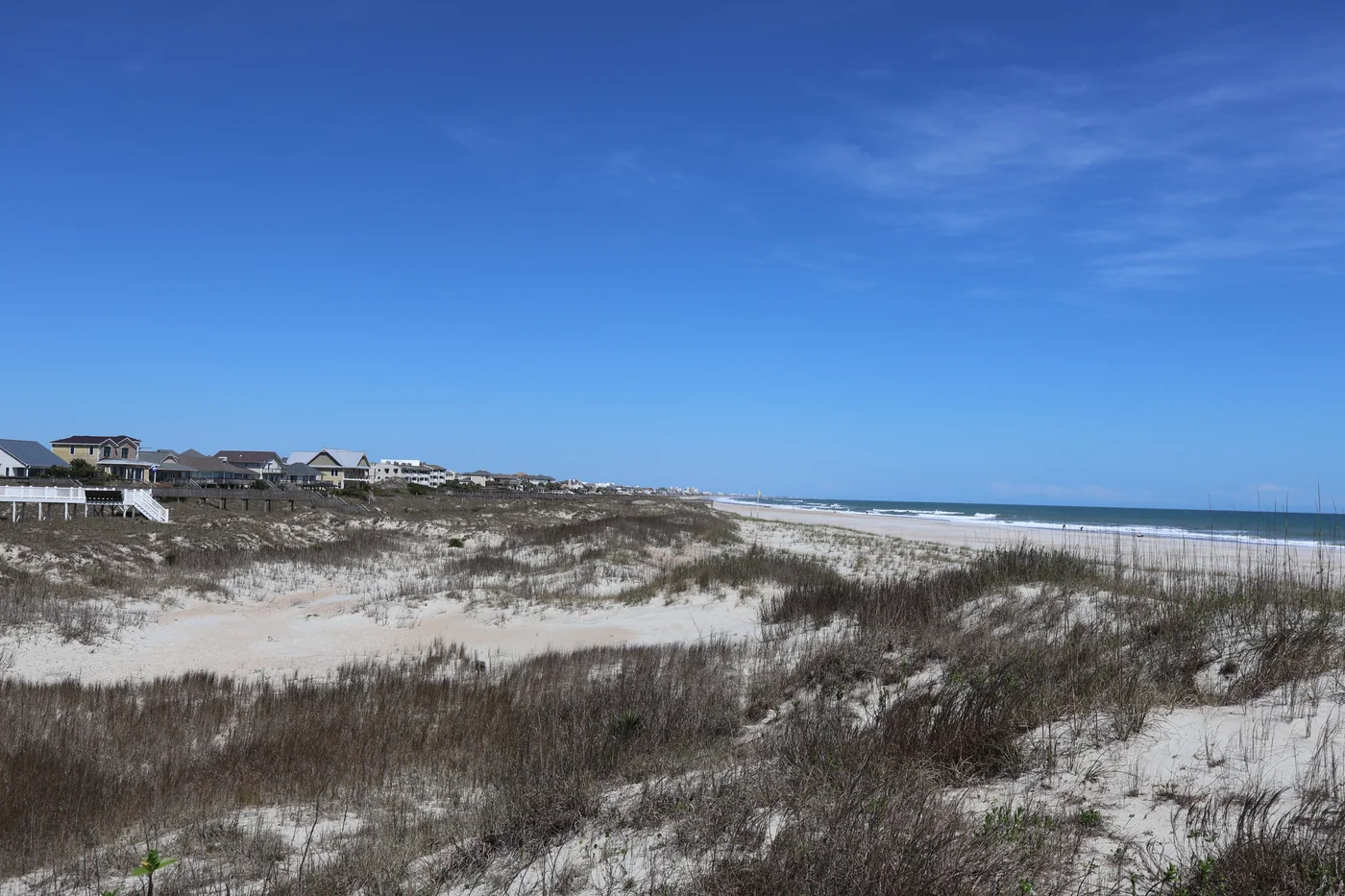 Beach dunes, coastal homes and the Atlantic shoreline at Emerald Isle, North Carolina.